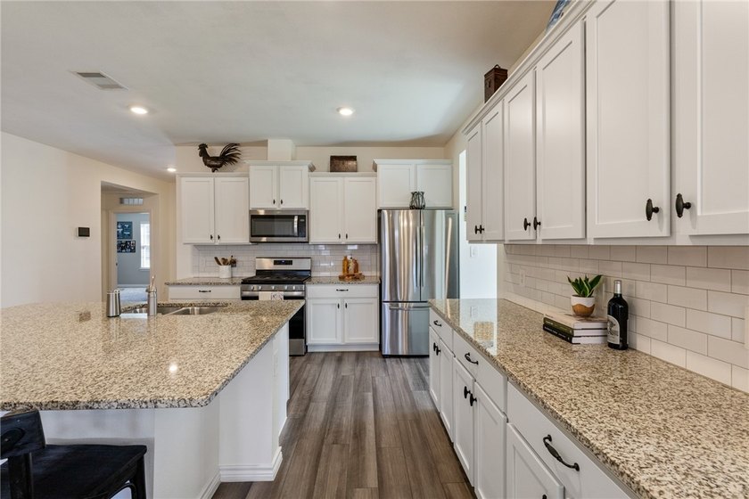 This beautiful 4 bedroom, 2 bath home is located in the - photo 3