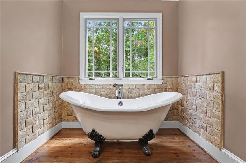 Nestled in a private, picturesque setting, this exceptional - photo 33
