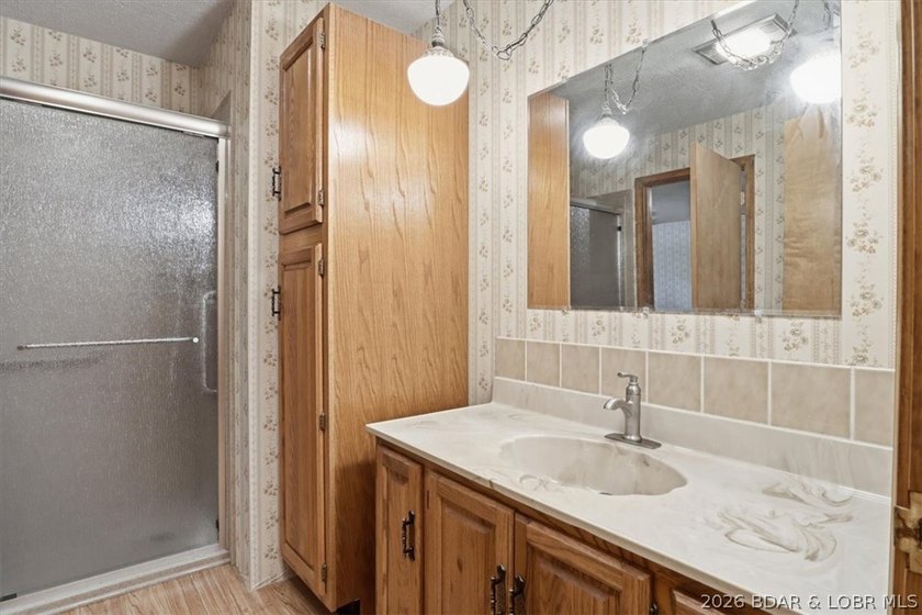 Discover the perfect blend of privacy, space, and lake living on - photo 24