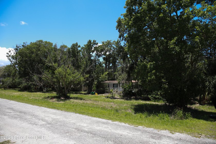 Discover the potential of this 2.6-acre vacant lot, offering a - photo 3