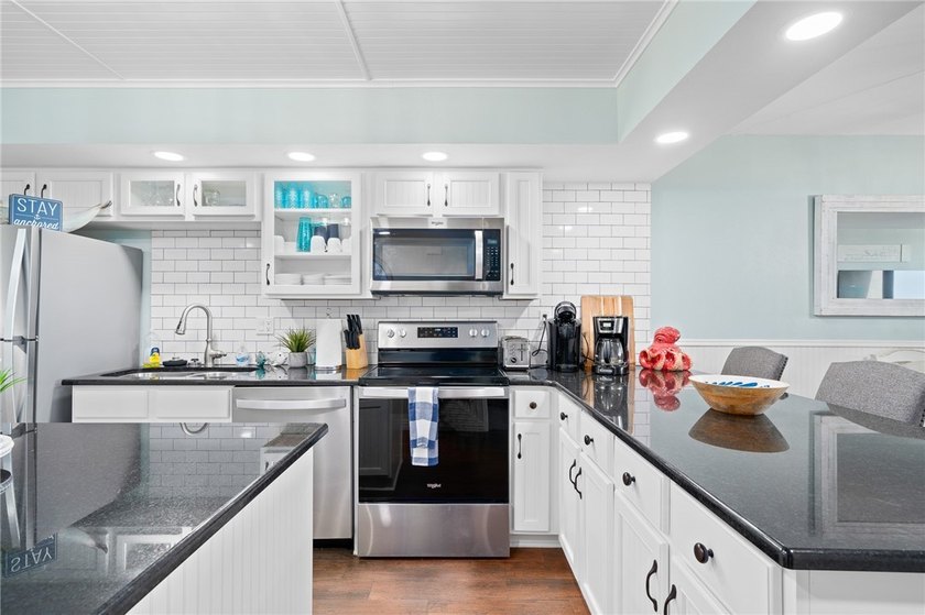 Wake up to sweeping Gulf views in this beautifully renovated - photo 6