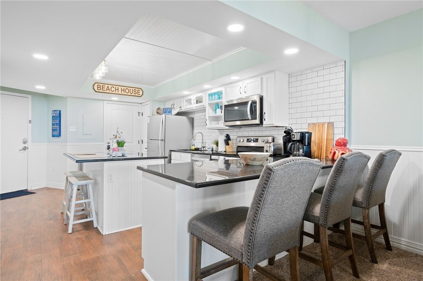Wake up to sweeping Gulf views in this beautifully renovated - photo 9
