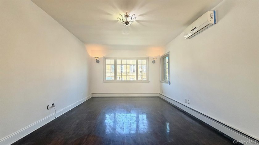This charming one-family home offers three bedrooms, two and a - photo 3