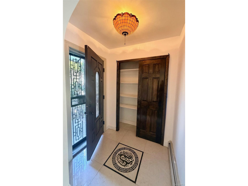 This charming one-family home offers three bedrooms, two and a - photo 6