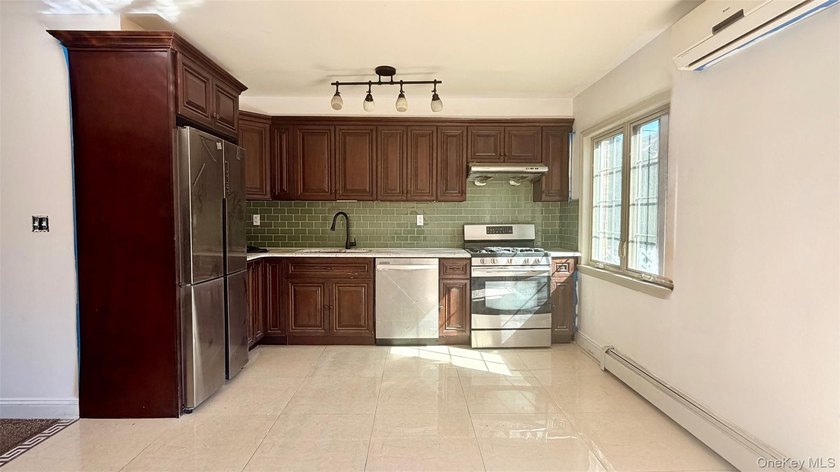 This charming one-family home offers three bedrooms, two and a - photo 7