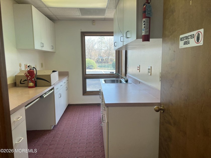 Available a one-story end unit office condo. The unit features - photo 15