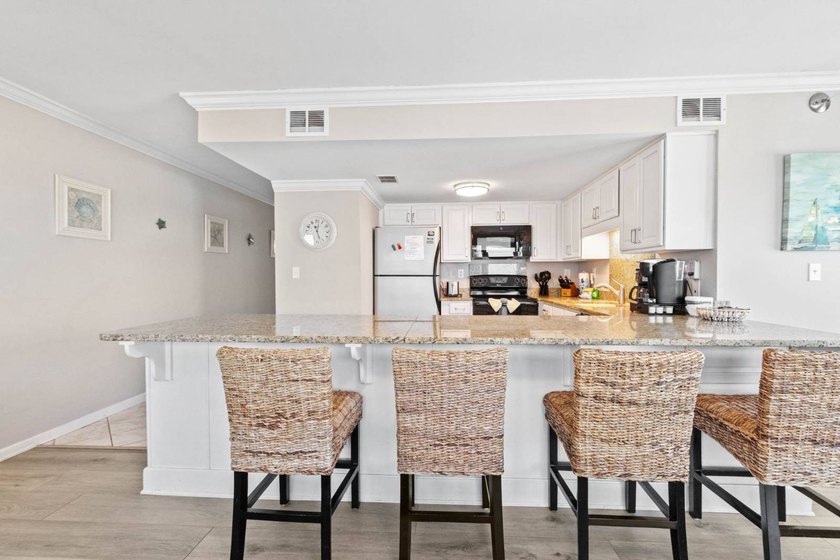 Beachfront living meets fresh coastal style in this updated - photo 8