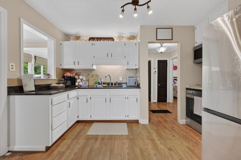 Welcome Home! This charming 1.5-story bungalow is situated on a - photo 21