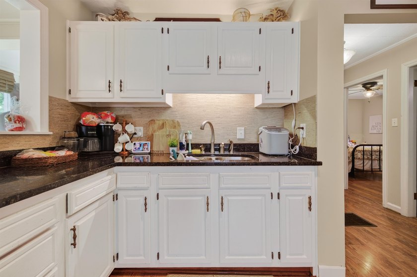 Welcome Home! This charming 1.5-story bungalow is situated on a - photo 23