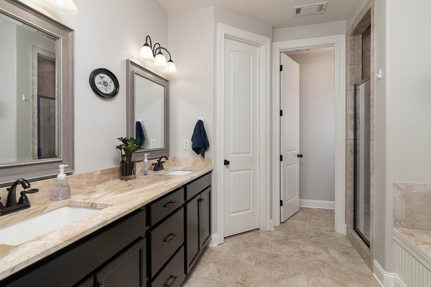 Tucked into The Lakes subdivision on 1.9 acres that includes - photo 12