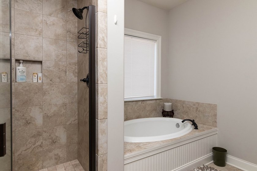 Tucked into The Lakes subdivision on 1.9 acres that includes - photo 13
