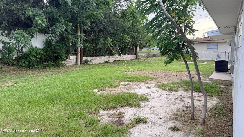 Beautifully remodeled concrete block 4/2 home with a new metal - photo 4