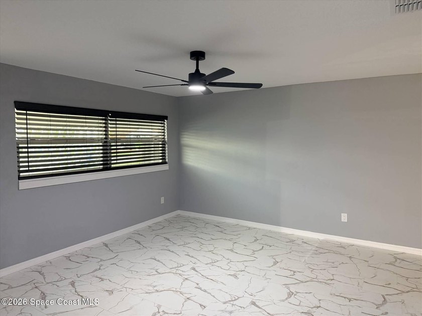 Beautifully remodeled concrete block 4/2 home with a new metal - photo 7