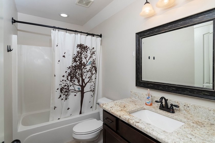 Tucked into The Lakes subdivision on 1.9 acres that includes - photo 19