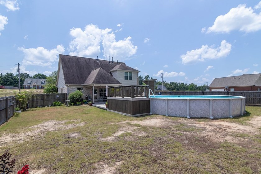 Tucked into The Lakes subdivision on 1.9 acres that includes - photo 24