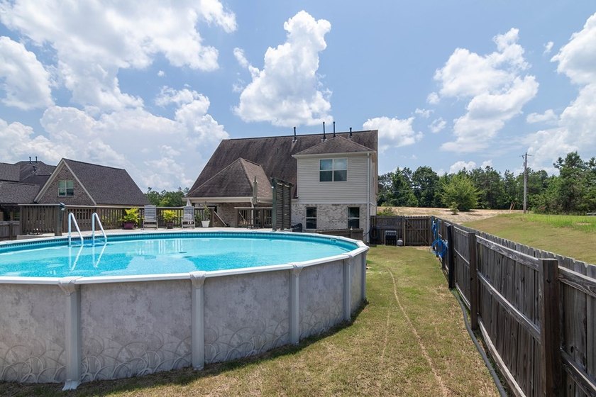 Tucked into The Lakes subdivision on 1.9 acres that includes - photo 26