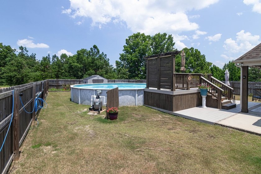 Tucked into The Lakes subdivision on 1.9 acres that includes - photo 27
