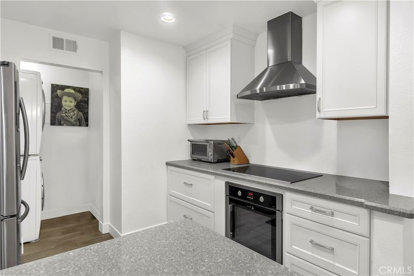Tucked inside the gated Villa Point community, this lower-level - photo 8