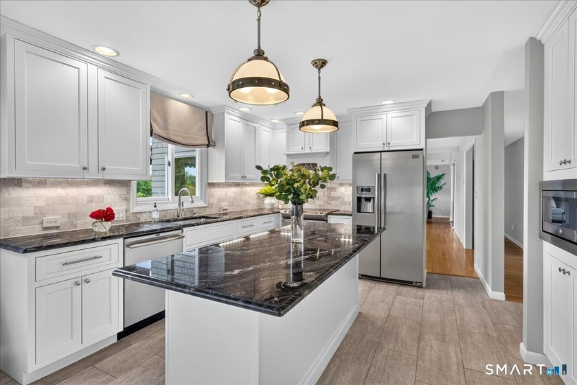 Two distinct homes. One extraordinary address. Both equal in - photo 6