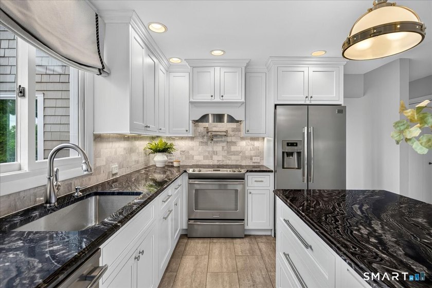 Two distinct homes. One extraordinary address. Both equal in - photo 7
