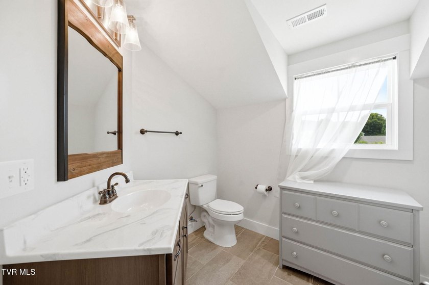 Modern farmhouse charm, an incredible 1.3-acre creekside setting - photo 24