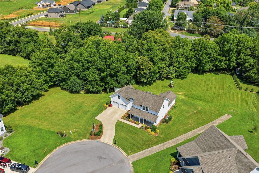 Modern farmhouse charm, an incredible 1.3-acre creekside setting - photo 36