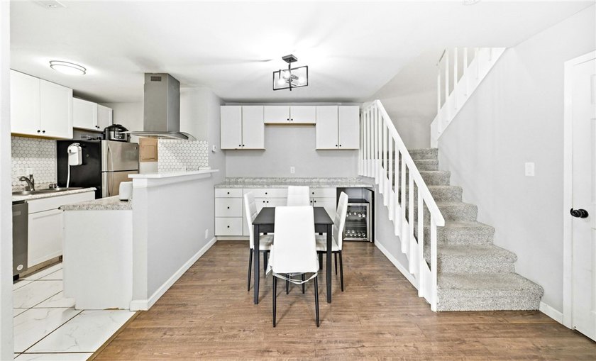 Desirable Lakewood Village featuring laminate and tile flooring - photo 5