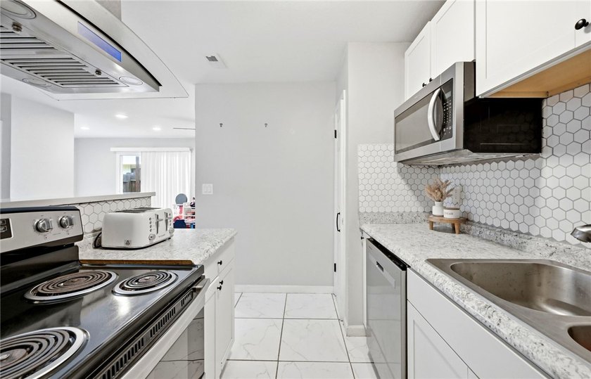 Desirable Lakewood Village featuring laminate and tile flooring - photo 7