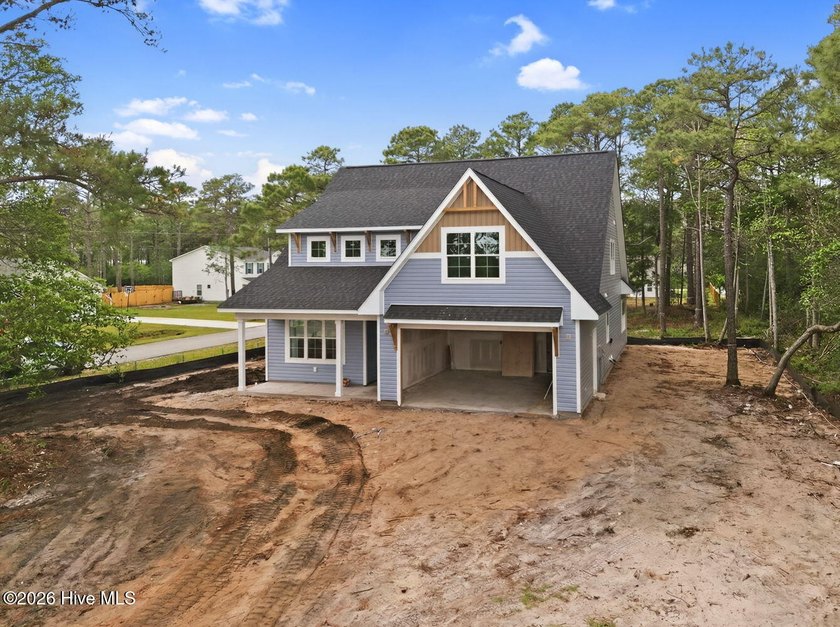 The Coquina by Elan Homes features a spacious and inviting - photo 3