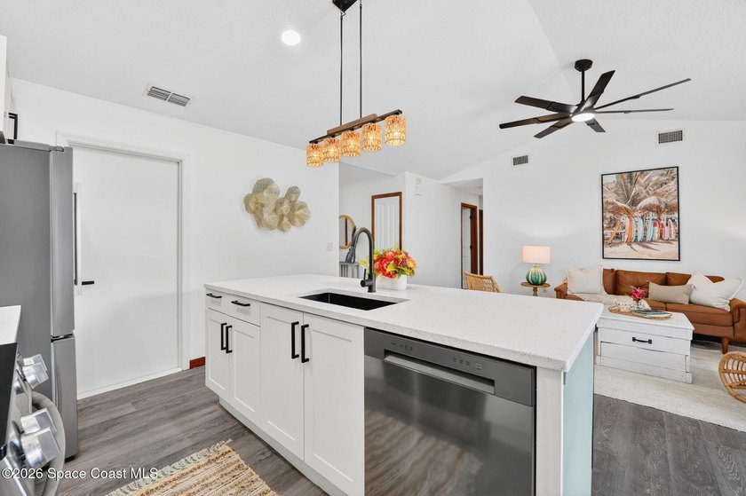 Set on an oversized .46-acre lot with mature trees, this - photo 14