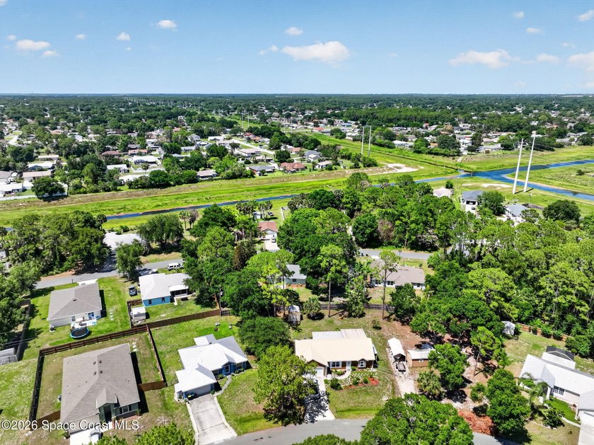Set on an oversized .46-acre lot with mature trees, this - photo 30