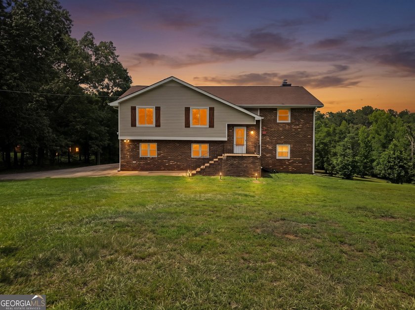 Nestled on 5 private acres with no HOA, this beautifully - photo 2