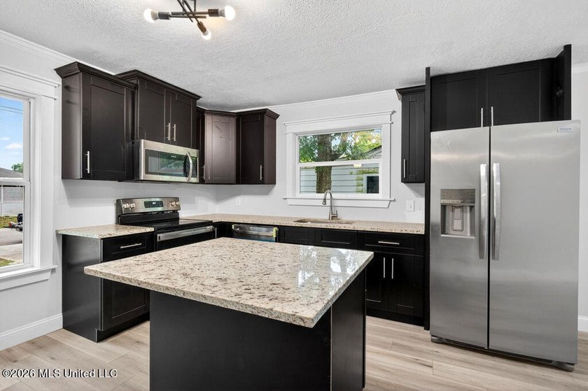 Completely remodeled and move-in ready! This home has been - photo 12