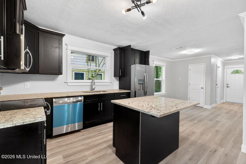 Completely remodeled and move-in ready! This home has been - photo 14