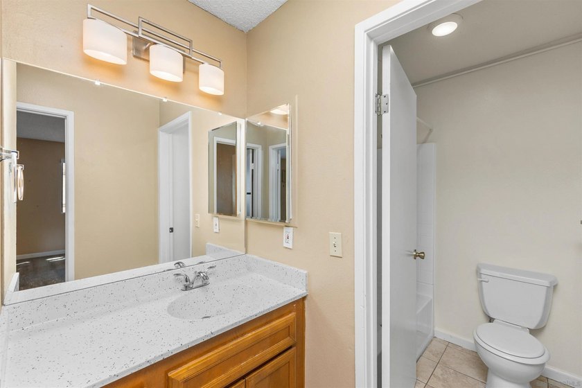 Tucked away in a peaceful setting within the desirable Allied - photo 14