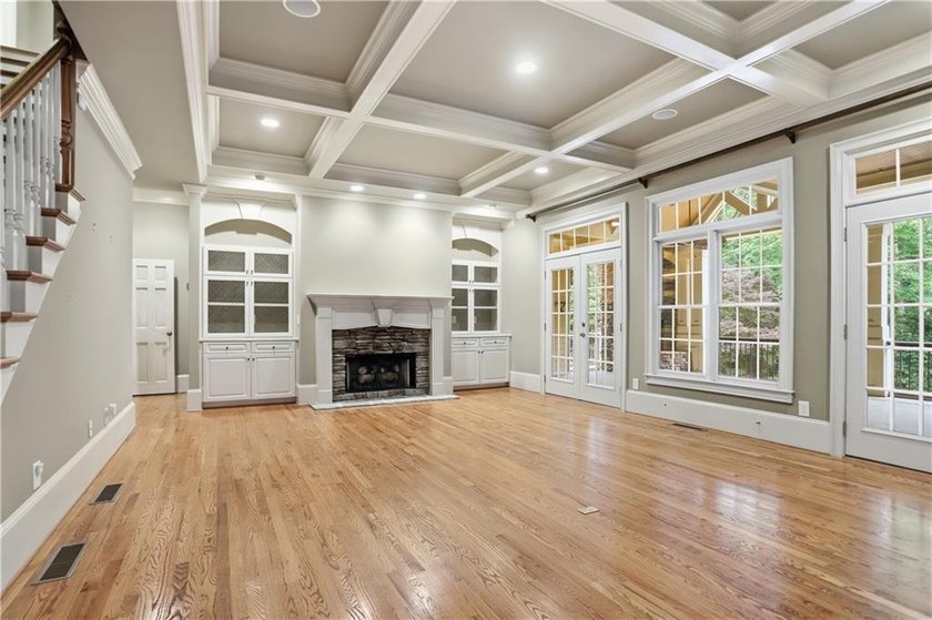 Nestled behind a sweeping lawn on a private, tree-lined lot - photo 8
