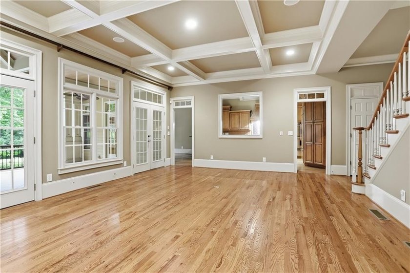 Nestled behind a sweeping lawn on a private, tree-lined lot - photo 9