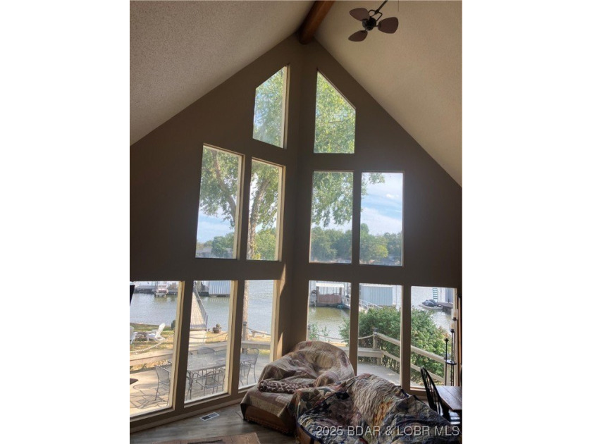 > A wall of windows and vaulted ceilings. Main level living! Big - photo 10