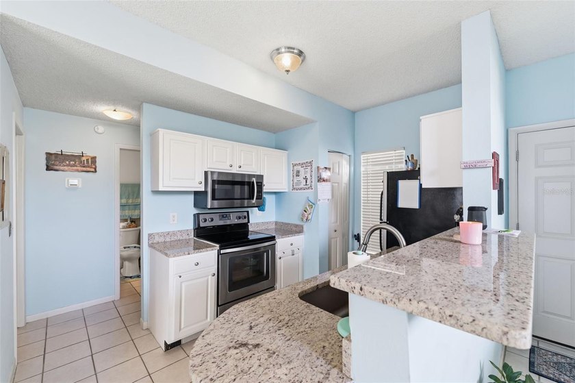 Welcome to this ground-floor, corner-unit condo that offers an - photo 14