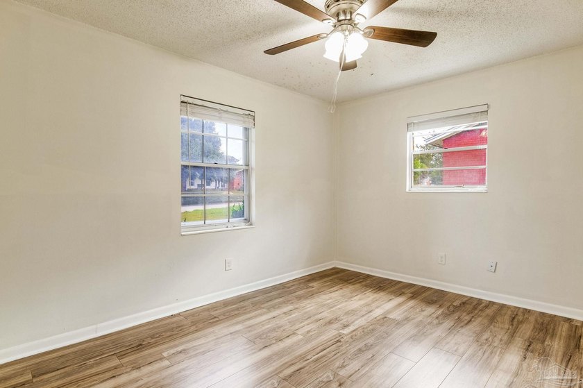 Step into the delightful 3-bedroom, 2-bath haven nestled in the - photo 15