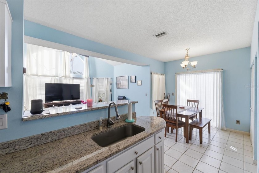 Welcome to this ground-floor, corner-unit condo that offers an - photo 17
