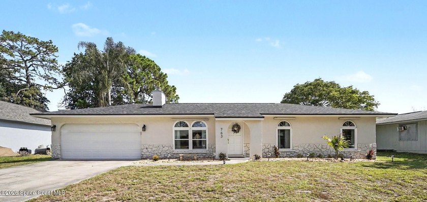 This exceptional 3-bed, 2-bath home in NW Palm Bay offers an - photo 2