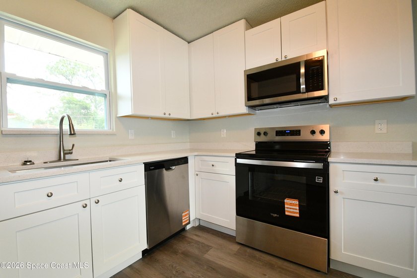 This updated Palm Bay home is set just off a main road, making - photo 6