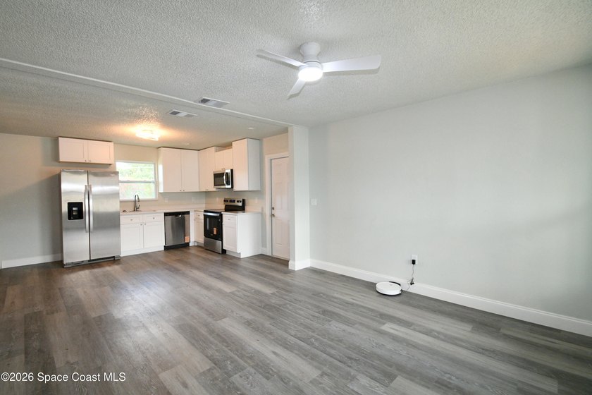 This updated Palm Bay home is set just off a main road, making - photo 8