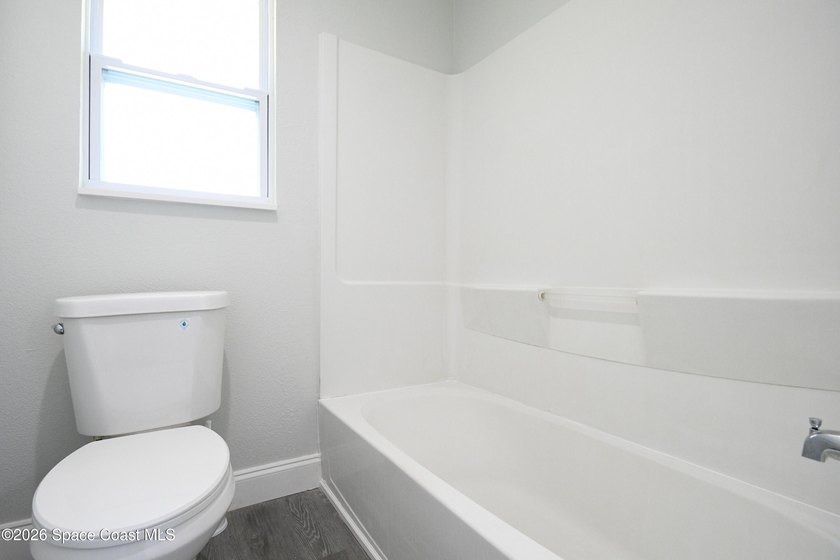 This updated Palm Bay home is set just off a main road, making - photo 10