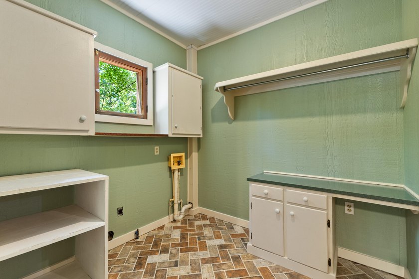 Hidden beneath towering hardwoods on a private wooded setting - photo 17