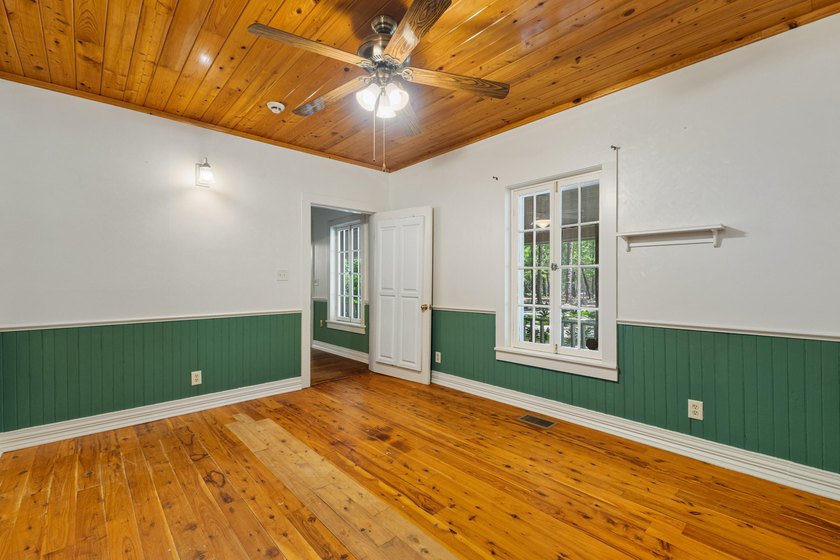 Hidden beneath towering hardwoods on a private wooded setting - photo 18