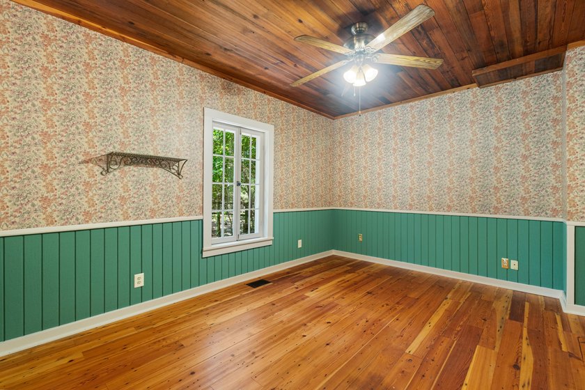 Hidden beneath towering hardwoods on a private wooded setting - photo 21