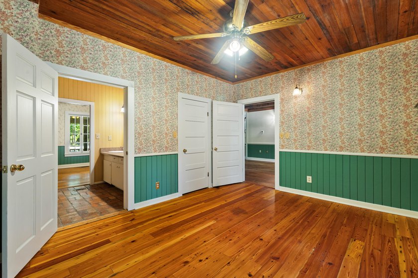 Hidden beneath towering hardwoods on a private wooded setting - photo 22