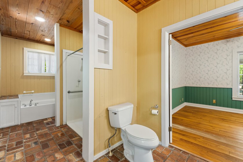 Hidden beneath towering hardwoods on a private wooded setting - photo 23